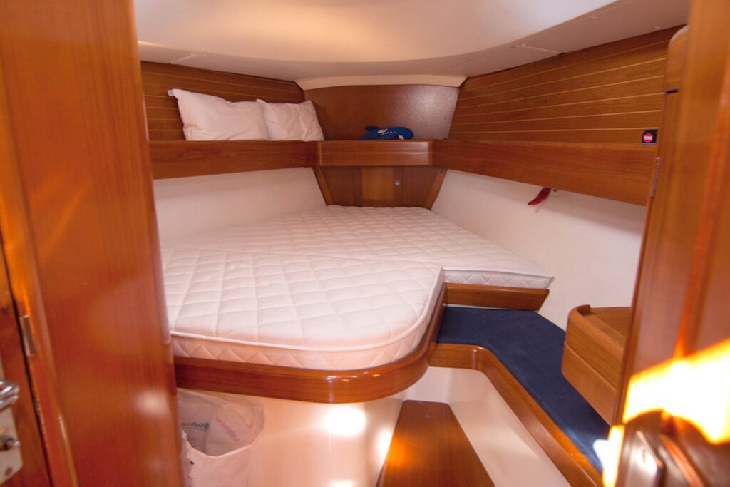 Made-to-measure boat mattress cut to fit the exact curvature of a yacht hull without gaps, featuring Freyaframes precision fitting.